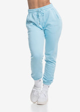A model wears the Sassy Sportswear Joggers Everyday in the Blue Sky color