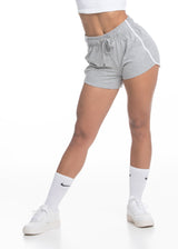 A model wears the Sassy Sportswear Shortpants Comfy Cotton in the Cloudy Grey color