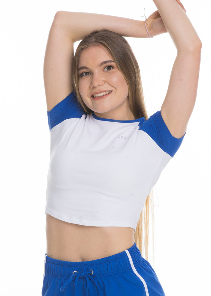 A model wears the Sassy Sportswear Crop Top Comfy Cotton in the Electric Blue color