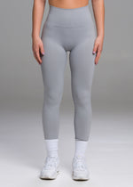 A model wears the Sassy Sportswear Leggings Timeless in the Marble Grey color