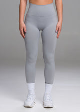 A model wears the Sassy Sportswear Leggings Timeless in the Marble Grey color